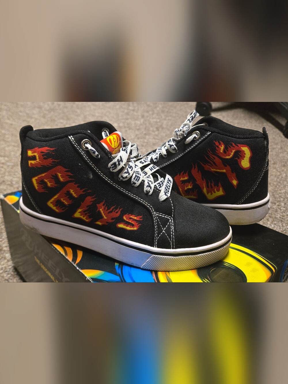 Heelys Black High-Top Sneakers with Red and Yellow Flame Design